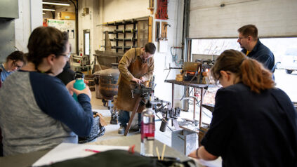 Students watching a presentation in welding class