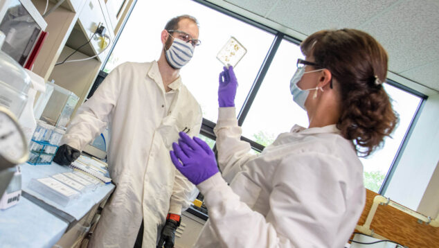 Two students working in a lab