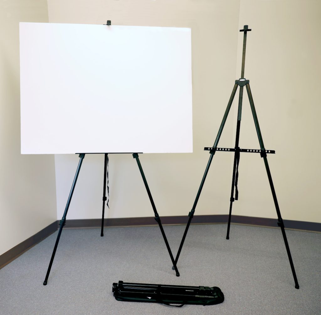 Two easels set up, one holding a poster board