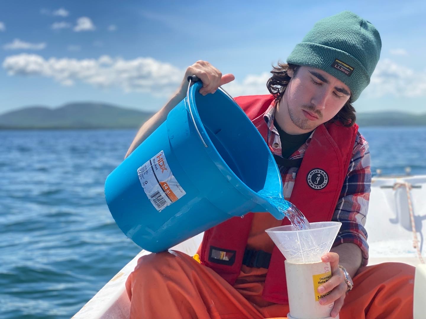 Student Nicholas Tiner, taking water samples from Frenchman Bay